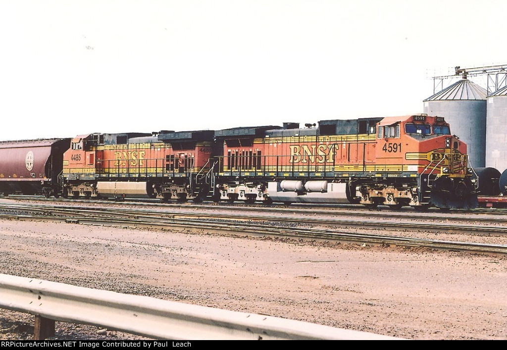 Tied down grain train waits in the yard